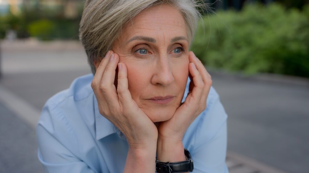 Upset disappointed thoughtful face pensive senior business woman sorrowful Caucasian sad old mature