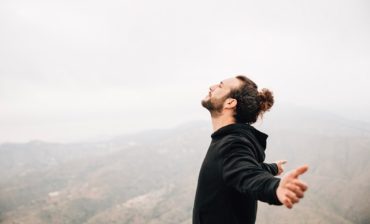 side-view-carefree-man-enjoying-freedom-with-arms-outstretched Medium