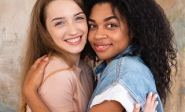 smiley-female-friends-hugging-posing-together Small